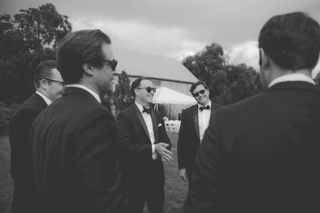 Davis and his grooms men talking a circle