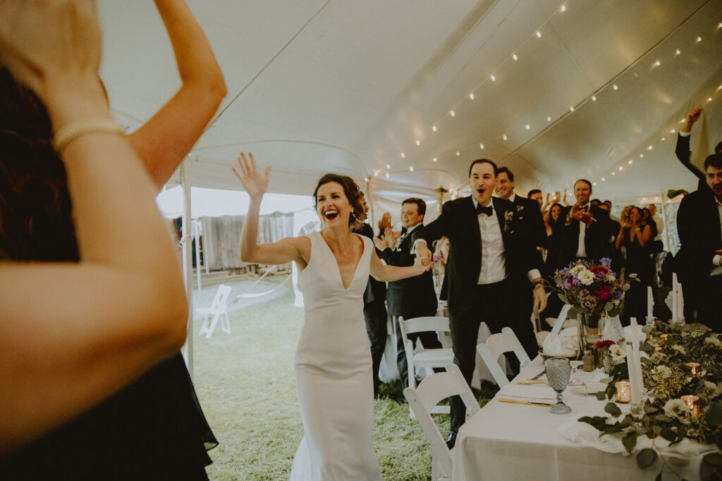 Nicole high-fiving her maid of honor