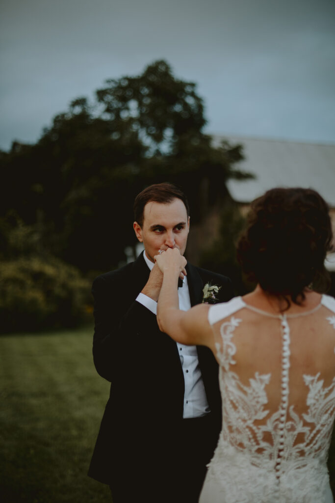 Davis kissing Nicole's hand